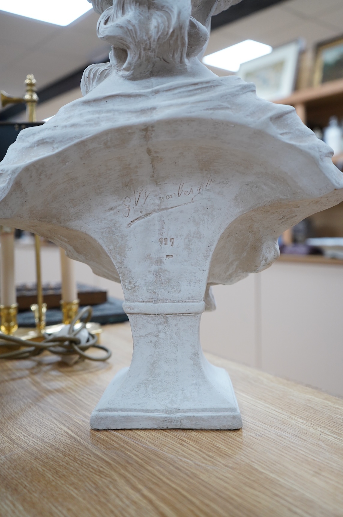 Two signed plaster busts, one after Gustave van Vaerenberg (1873 - 1927), the other after Rene Maquet (19th century), tallest 52cm